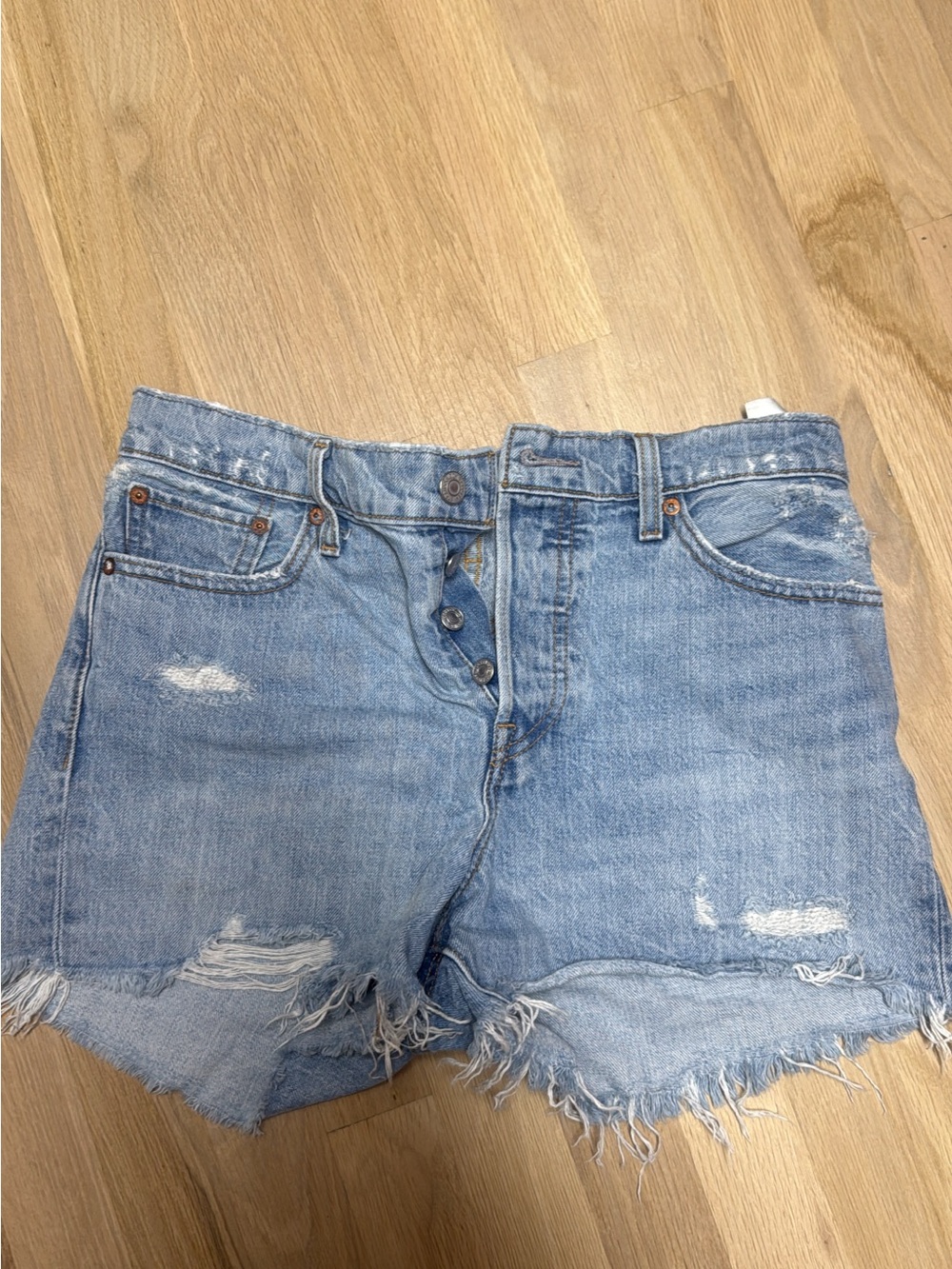 Levi's Faded Blue Distressed Cutoff Denim Shorts